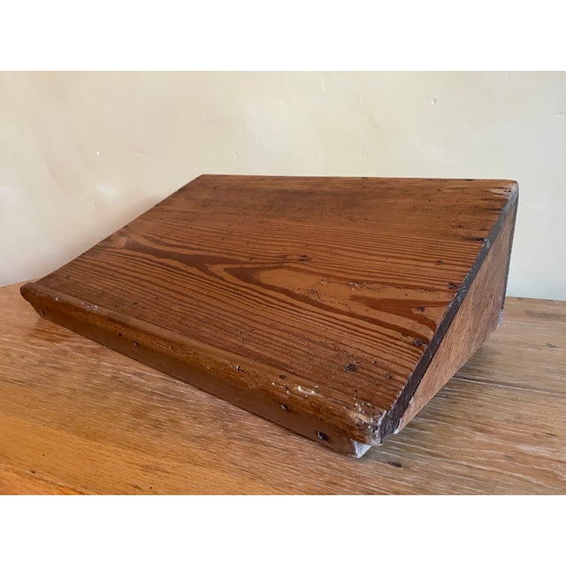 A lectern from France made of very beautiful atmospheric pine wood. On the back or front however you look at it is a brass...