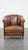 This comfortable vintage sheep leather club chair with a special, characteristic appearance and finished with black...
