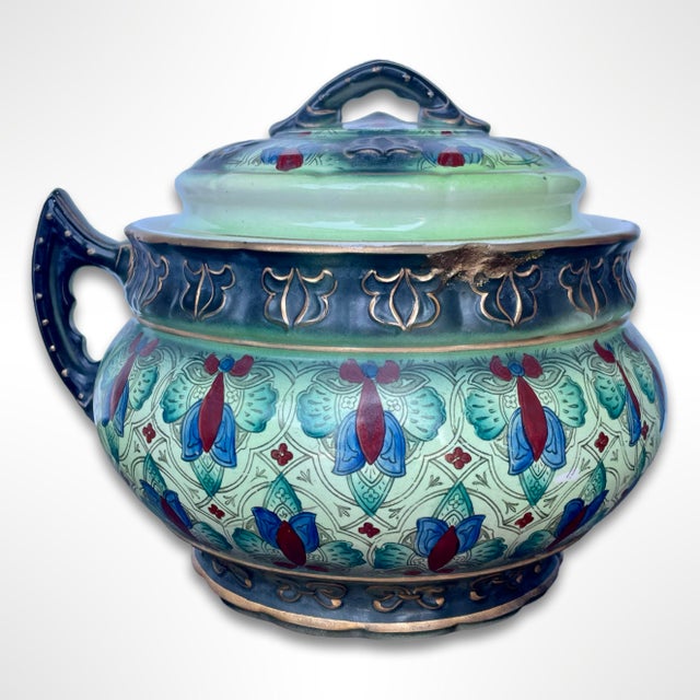 Brighten up your space with this striking vintage ceramic jar, a charming blend of history and artistry. Featuring a...