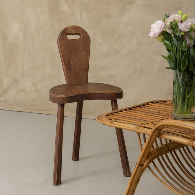 Great carved wood Brutalist tripod chair from France, 1950's. Three thick chiseled wood legs with wide seat and slender...