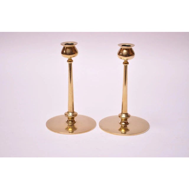 Midcentury brass turned candlesticks, each with bulbous bobeche and cylindrical stem on circular base. Nice, polished...