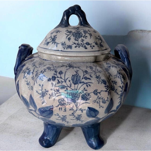 Add timeless elegance to your dining table or display cabinet with this stunning vintage blue and white ceramic footed...