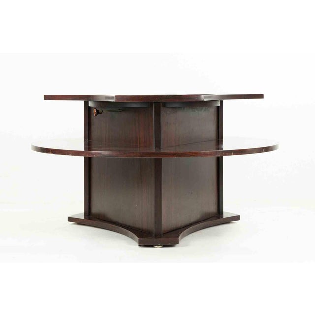 Vintage rosewood table with bottle storage, realized by an italian manufacture in 1960s. Very good condition.