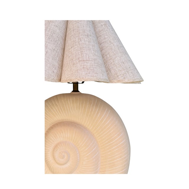 A breathtaking pair of vintage ceramic lamps sculpted as chambered nautilus shells — each a meditation on natural...
