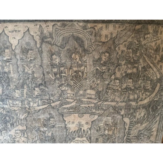 A mid-20th century 'Kamasan' cotton textile painting from Bali, Indonesia. The hand-painted image has great detail and...