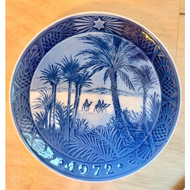 A beautiful pair of authentic Royal Copenhagen annual Christmas collector plates from Denmark, featuring two beloved mid-...