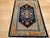 This vintage Tibetan rug is a striking and meaningful piece, featuring a bold medallion design set against a deep black...