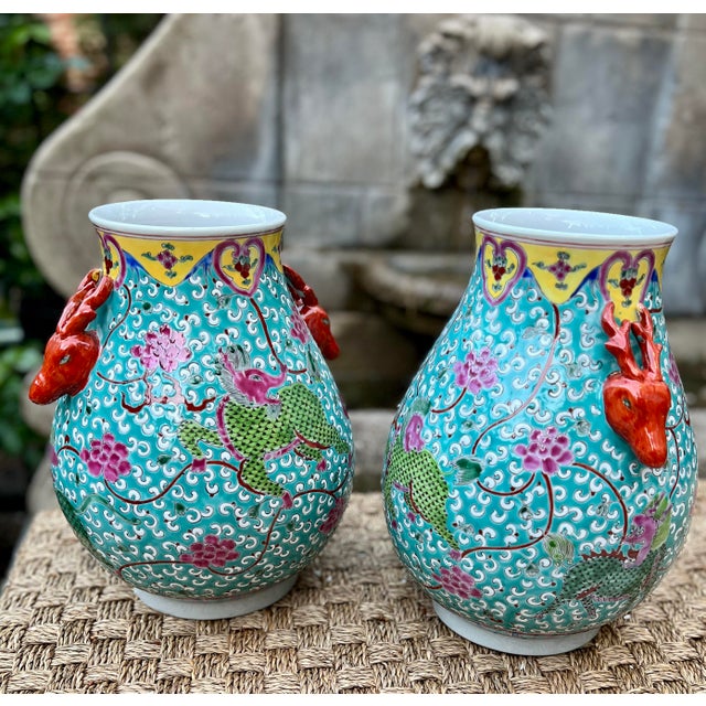 This pair of hand-painted porcelain vases features the mythical Qilin — a guardian creature symbolizing peace and...