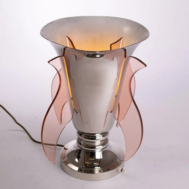 H: 37cm w: 33cm d: 33cm a french art deco sue et mare silver plated table uplighter with peach glass winged light...