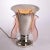 H: 37cm w: 33cm d: 33cm a french art deco sue et mare silver plated table uplighter with peach glass winged light...