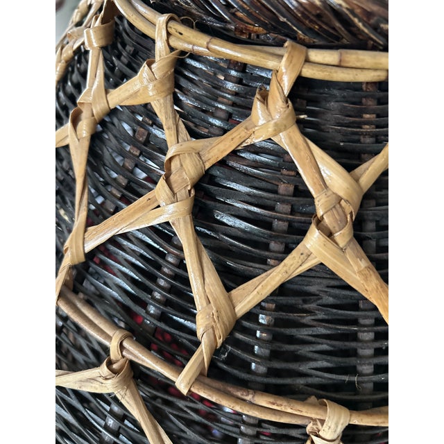 Up for sale is a striking, highly decorative vintage Southeast Asian fishing creel basket. Sourced from a prominent local...