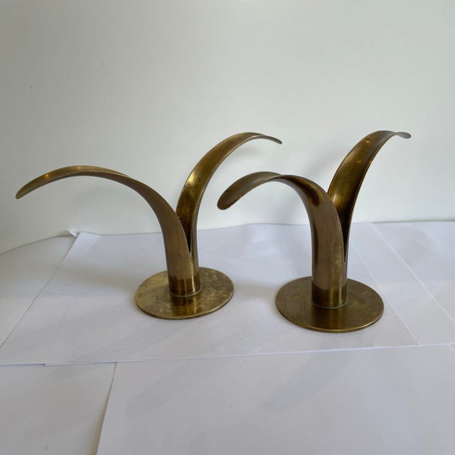 These vintage candle holders are the iconic “Lohan”or Lilly model originally designed by Ahlenius Bjork for Ystad Metals...