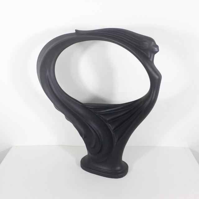 Fabulous art nouveau style matte black ceramic sculpture of a flying or dancing woman. Possible tiny chips at base that...