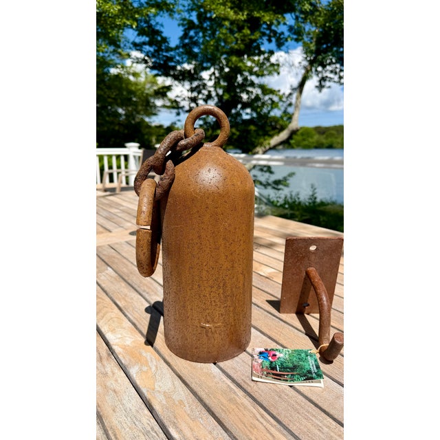 Gorgeous vintage Tom Torrens modernist bell complete with original bracket for hanging. Forged heavy duty steel has aged...