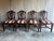Set of 8 beautifully carved mahogany Hepplewhite style chairs in need of restoration. This set includes two arm chairs and...