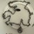 It includes an oval metal hangtag that displays the brand logo of Liz Palacios C S.F., a designer based in San Francisco...