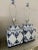 Chinoiserie porcelain table lamps in a blue and white pattern. These large, square lamps still have their original,...