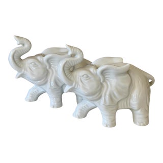 Pair of Vintage Inarco White Glazed Elephant Figurines With Raised Trunks For Sale
