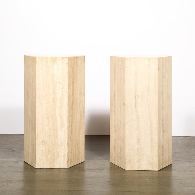 A striking pair of Mid-Century Modern hexagonal pedestals, crafted in rich travertine circa 1970, embodying the geometric...
