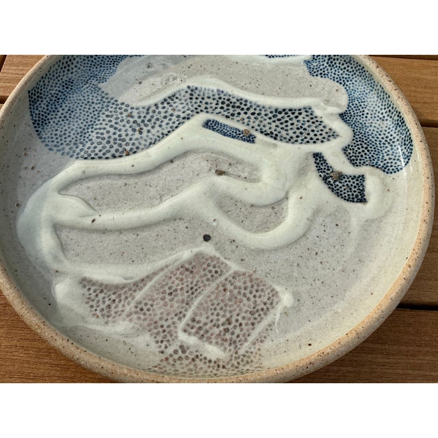 This decorative stoneware plate is part of the PENADA LANDSCAPE COLLECTION, circa mid 1980s-1990s, from the late Dennis...