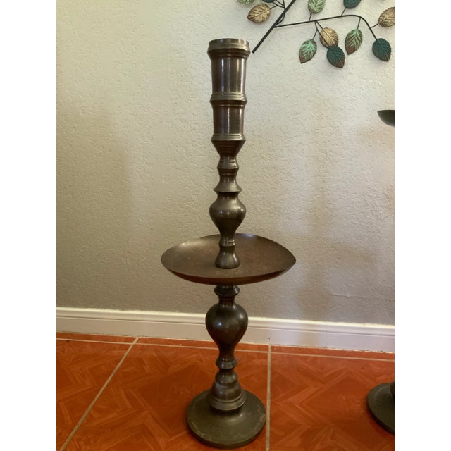 Used in great condition Vintage Brass Pillar/Candlestick holder Floral design One is 30” The other is 36” One plate is a...