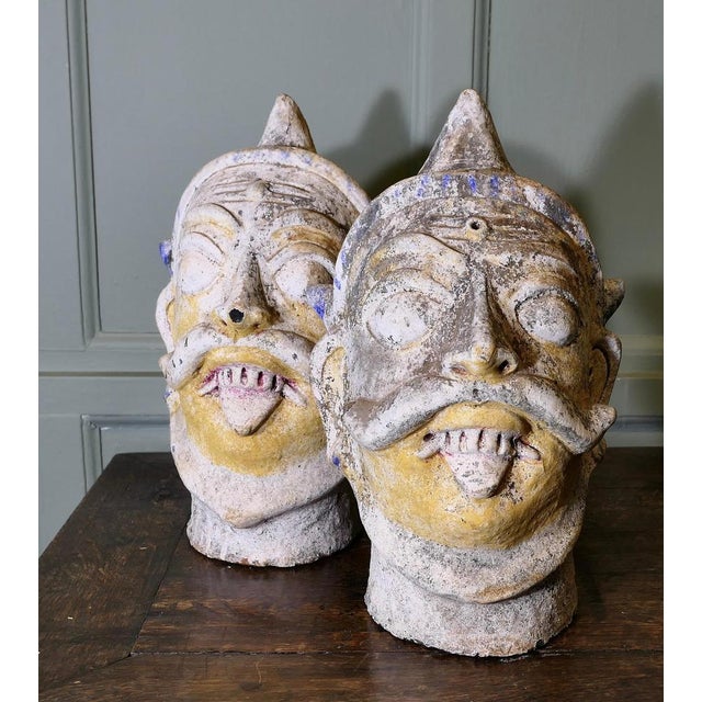 2 Antique Large Indian Terracotta Tent Pole Tops These wonderful pieces have been made in the image of frightening...