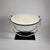 A French Art Deco period round side table from France circa 1930. The Black lacquer base supports a double U shaped...