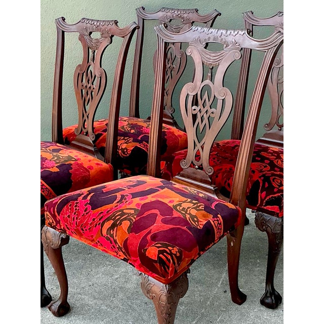 This exceptional set of four hand-carved mahogany dining chairs seamlessly blends 18th-century Chippendale elegance with...