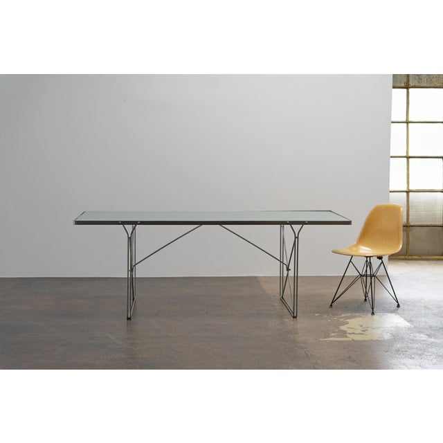 Dining table “Moment” by Niels Gammelgaard for IKEA, designed in the 1980s. Featuring a powder-coated metal frame in matte...