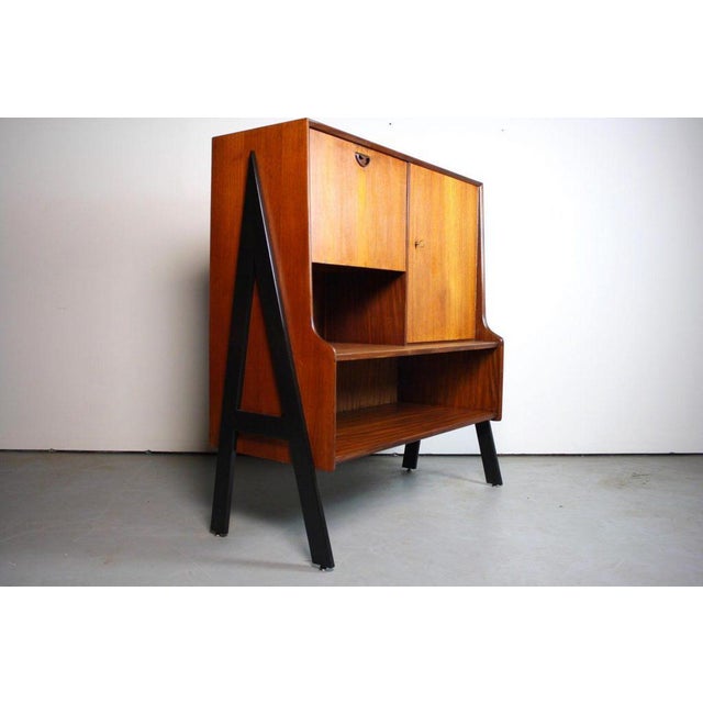 About this One of a Kind Two-Tone Danish Mid Century Bar Cabinet This versatile two tone piece has potential in any and...