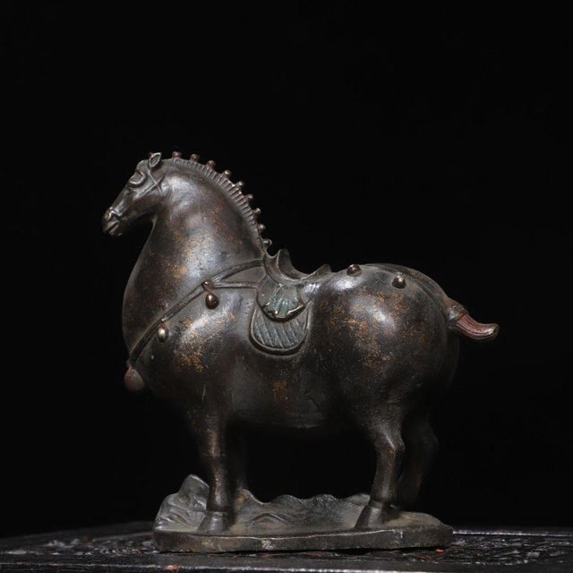 This is an elegant vintage Chinese bronze figure of a horse, crafted in the classic Tang dynasty style. The horse stands...