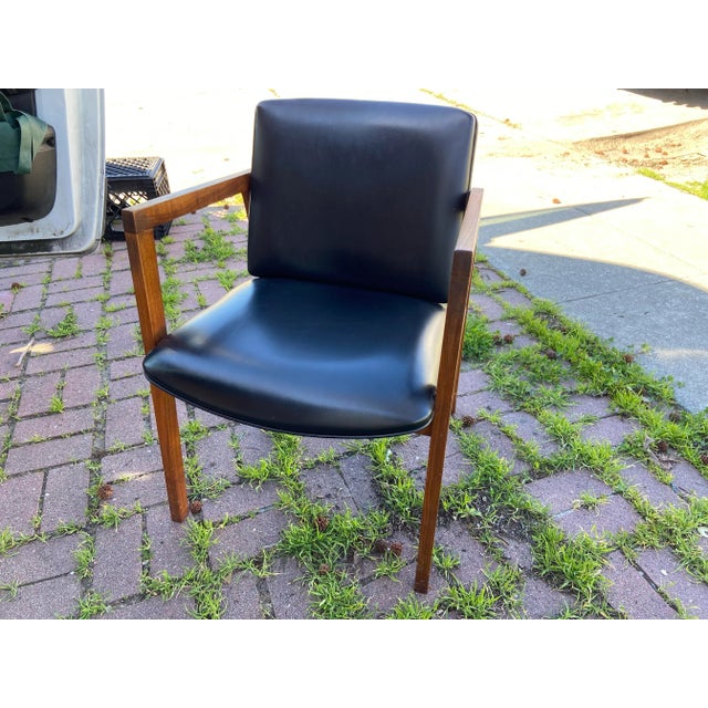 Vintage mid century modern walnut arm chair side chair by united chair company, finished in black vinyl upholstery, minor...