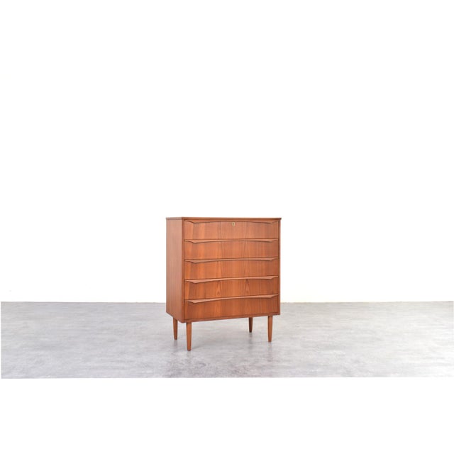 This Danish chest of drawers from the 1960s is an example of Mid-Century Modern design, which emphasized proportion,...