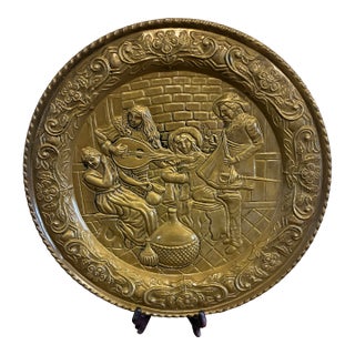 English Embossed Brass Decorative Wall Plate With Medieval Musicians Scene For Sale
