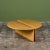 An American made coffee table, c.1970s, by Gerald McCabe is beautifully crafted from a solid slab of maple. The piece...