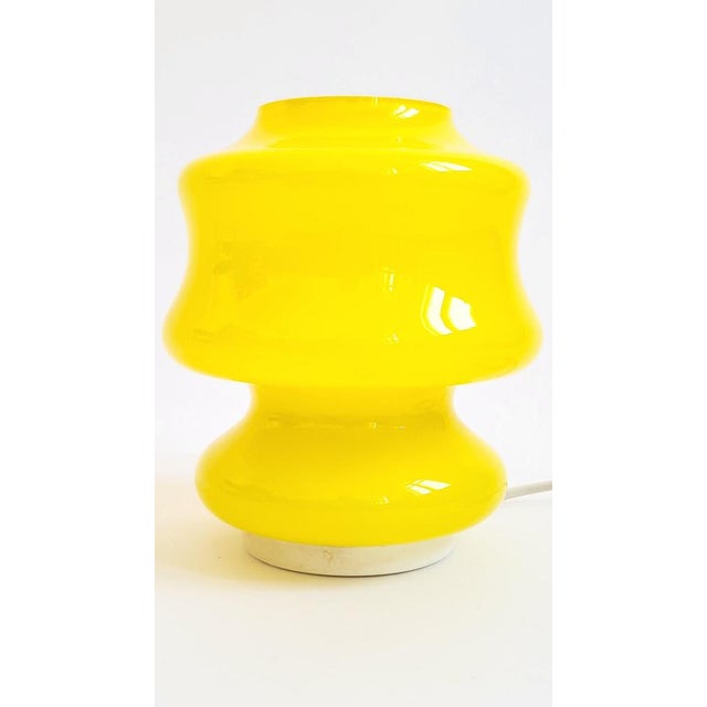 A classic Italian mid-century design: glamorous, fluid, and futuristic in form: a boldly colored, canary yellow Space...