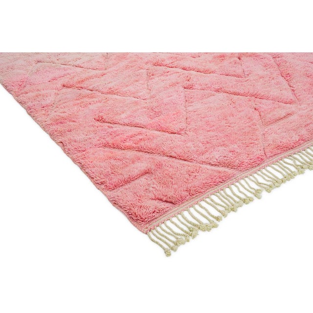 Luxurious hand-knotted wool rug in a soft Blossom and Pink, featuring a subtle chevron pattern. This plush Berber piece...