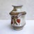 Elio Schiavon | Albarello Vase with polychrome terracotta decoration to flowers on white base | H.cm. 14,5x10 | signed...