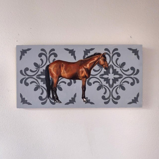 This artwork features a detailed portrayal of a chestnut horse set against a softly patterned background that enhances its...