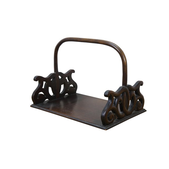 Late 20th century mahogany book rack / library tray / magazine holder. Rectangular base with pierced scrollwork ends...