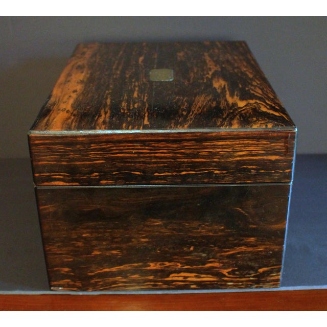 Circa 1835 English coromandel jewelry box. "Secret" release tray in base. Bramah type lock. Brass engraving shield, no...