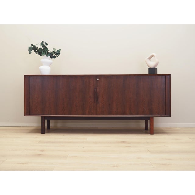 The sideboard was made in the 1960s, produced by the renowned Danish Sibast manufactory. Designed by Danish design icon...