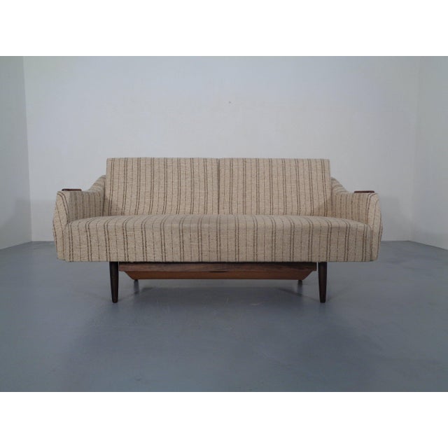 Sofa bed with storage compartment, convertible to a daybed, from the 1950s. Made in Sweden. The headrests are adjustable...