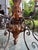Expressive 1940’s country French style chandelier. Hand carved with scrolling wrought iron arms extending from the center...