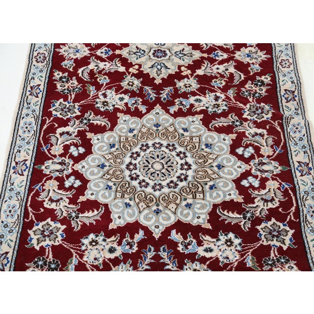 Nain rugs are renowned for their detail and fine use of outlining along the central motifs. Breaking from the classical...