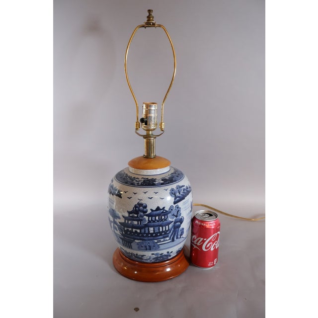 Vintage Chinese blue and white porcelain ginger jar table lamp featuring a traditional landscape of pagodas, pavilions,...