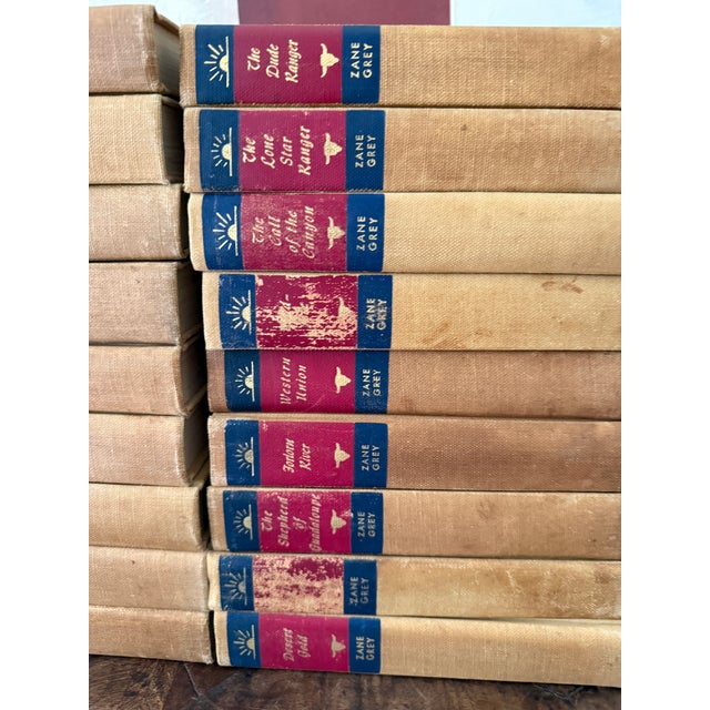 Paper Mid-Century Set of 27 (Twenty Seven) Zane Grey Books Vintage Western Collection Tan Cloth Binding Red Blue Spine For Sale - Image 7 of 12