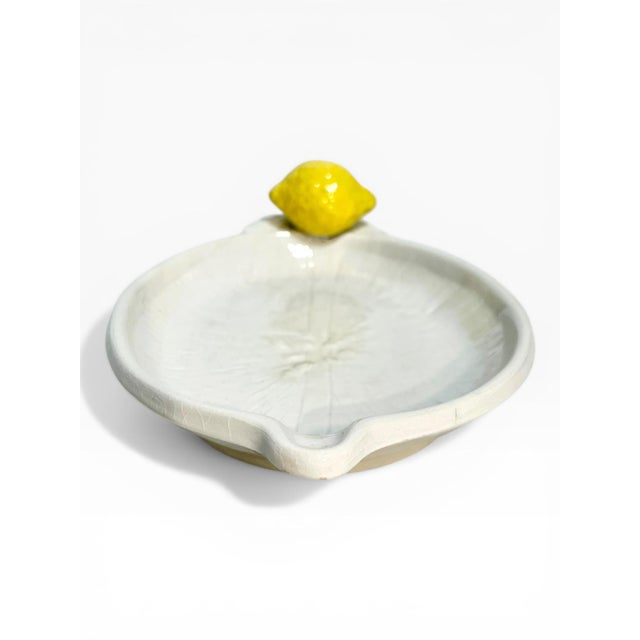 Charming vintage Italian lemon dish. Has a small spout at one end. Center has raised lemon details.