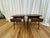 This exceptional pair of mid-century modern style end tables is a masterclass in clean architectural lines and functional...