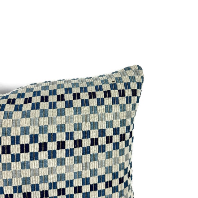 From Kravet Couture is Vernazza in the color Indigo pillow cover. A light gray chenille base with navy, blue, and light...